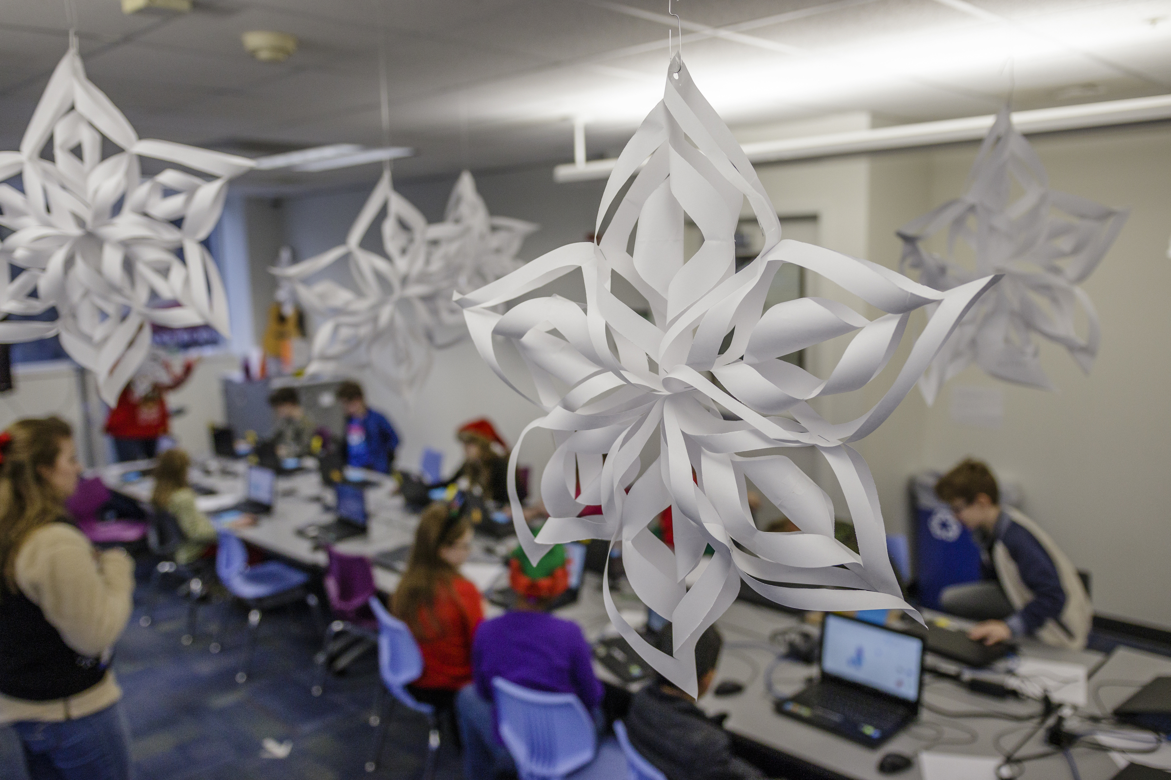 Decorative snowflakes made by students are displayed at Tech Town's winter break camp in the Edney Innovation Center on Friday, Dec. 22, 2017, in Chattanooga, Tenn. Tech Town offers technology-centric camps and education for children in subjects ranging from video production and computer coding to electronics and robotics.