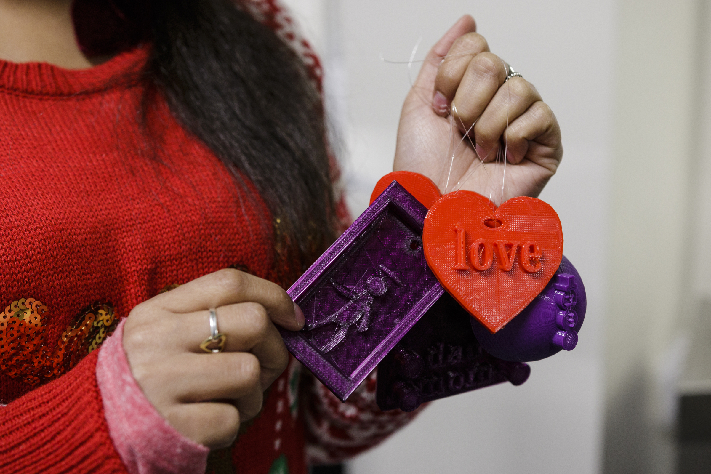 Dayna Bruell holds 3D printed ornaments made by children at Tech Town's winter break camp in the Edney Innovation Center on Friday, Dec. 22, 2017, in Chattanooga, Tenn. Tech Town offers technology-centric camps and education for children in subjects ranging from video production and computer coding to electronics and robotics.