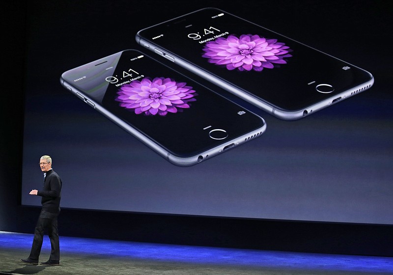 FILE - In this March 9, 2015 file photo, Apple CEO Tim Cook talks about the iPhone 6 and iPhone 6 Plus during an Apple event in San Francisco.