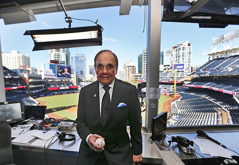 
              FILE - In this Sept. 29, 2016, file photo, Dick Enberg, the voice of the San Diego Padres, poses in his booth prior to the Padres' final home baseball game of the season in San Diego. Enberg, the sportscaster who got his big break with UCLA basketball and went on to call Super Bowls, Olympics, Final Fours and Angels and Padres baseball games, died Thursday, Dec. 21, 2017. He was 82. Engberg's daughter, Nicole, confirmed the death to The Associated Press. She said the family became concerned when he didn't arrive on his flight to Boston on Thursday, and that he was found dead at his home in La Jolla, a San Diego neighborhood. (AP Photo/Lenny Ignelzi, File)
            