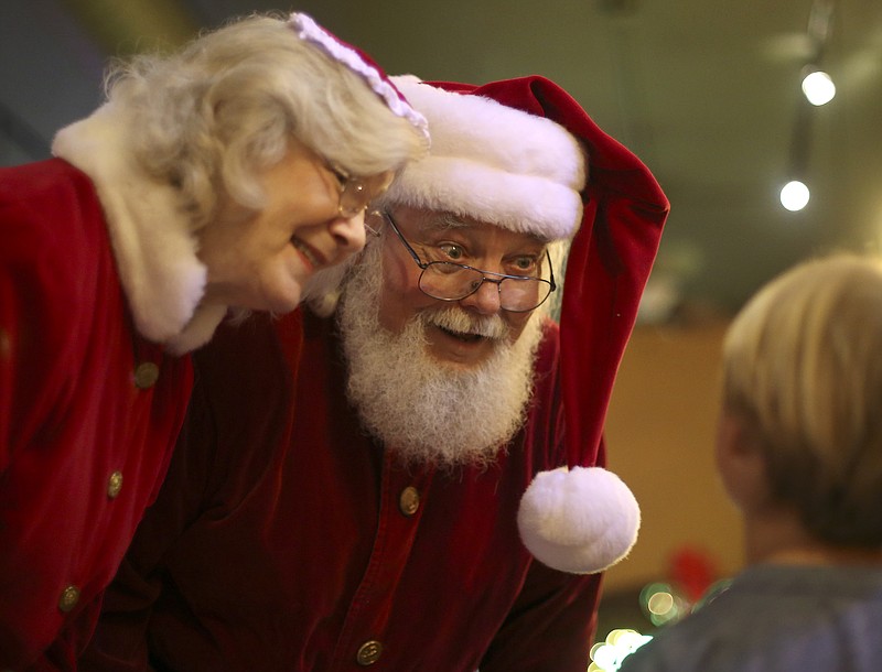 Santa Claus, played by Jim Trubey, and Mrs. Claus, played by Jenny Matlock, meet with 6-year-old Hayes Grinnell at Station House on Friday, Dec. 22, 2017 in LaFayette, Ga. Trubey is returning to Erlanger on Christmas morning as Santa to give back to the hospital that helped him, having had major surgery done at the hospital in 2014.