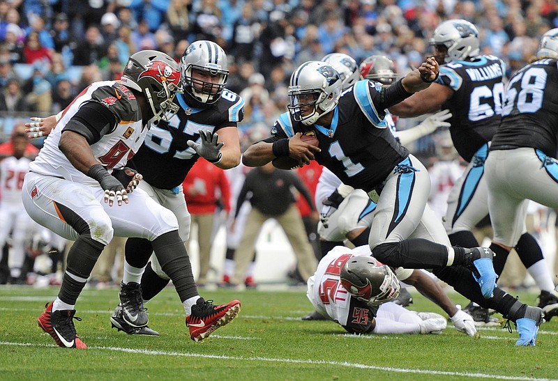 Carolina Panthers quarterback Cam Newton (1) leads a huddle during