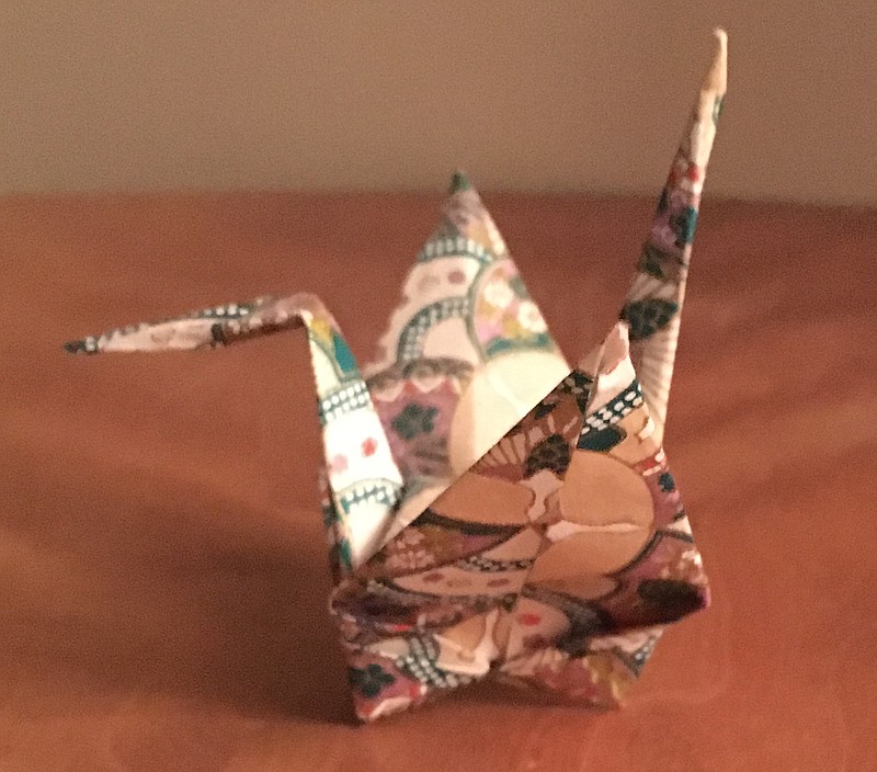 An origami crane folded by Keiko Brewer.