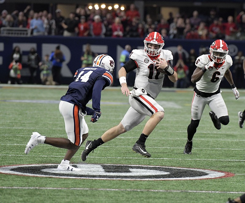 Georgia freshman quarterback Jake Fromm gets loose for a 17-yard run during the victory over Auburn earlier this month in the SEC championship game.