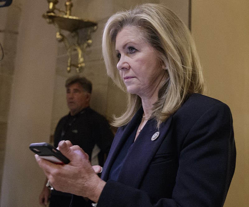 In a Thursday, Oct. 26, 2017 file photo, Rep. Marsha Blackburn, R-Tenn., leaves the House chamber after the House gave a significant boost to President Donald Trump's promise to cut taxes, in Washington. While neither of Tennessee's top GOP candidates, Rep. Marsha Blackburn and former Rep. Stephen Fincher, has the kind of personal baggage that Republican Roy Moore had in the Alabama race won by a Democrat, both have wholeheartedly embraced President Donald Trump at what Democrats hope is exactly the wrong time. (AP Photo/J. Scott Applewhite, File)