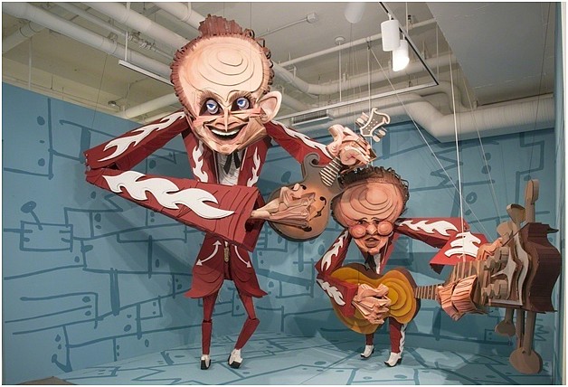 The Louvin Brothers marionettes by Wayne White are 168 inches by 192 inches, made of cardboard, wood, acrylic and rope.