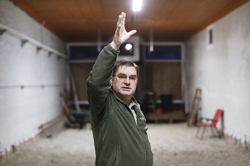 Rodney Embrey, an employee at nearby Buckingham coal mine, describes the process of renovating the building he and a business partner purchased to start an antiques dealership, Thursday, Dec. 14, 2017, in Corning, Ohio. Communities across Appalachia are turning increasingly to the region's rich reserves in things other than coal, namely, history and rugged natural beauty, to frame a new tourist economy. Enjoying a drink, hike or overnight stay or in region infused with stories, sweat and strife is turning out to be a draw to aging baby boomers and millennials alike. Studies show these efforts are attracting tourists, new residents and a new sense of self-worth. (AP Photo/John Minchillo)