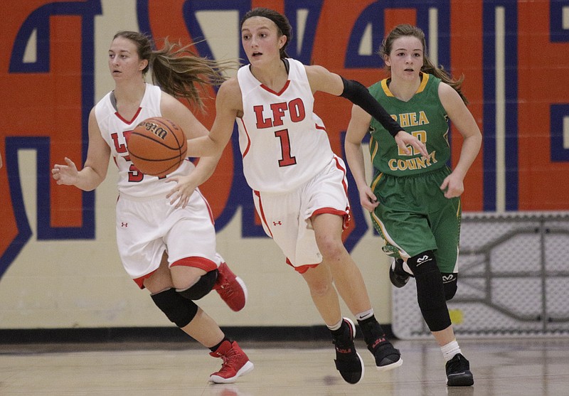LFO's Macey Gregg, center, dribbles ahead of teammate Anna Rountree, left, and Rhea County's Mallory Hampton during their Times Free Press Best of Preps basketball game at Chattanooga State Technical Community College on Thursday, Dec. 28, 2017, in Chattanooga, Tenn.
