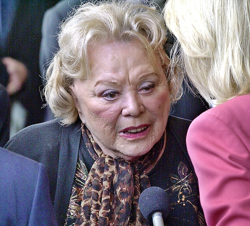 In this April 1, 2002, file photo, actress and comedian Rose Marie talks to the press as she arrives for a ceremony honoring comedian Milton Berle at Hillside Memorial Park and Mortuary in Los Angeles. Family spokesman Harlan Boll said Marie, the wisecracking Sally Rogers of "The Dick Van Dyke Show," died Thursday, Dec. 28, 2017. She was 94. (AP Photo/Nick Ut, File)