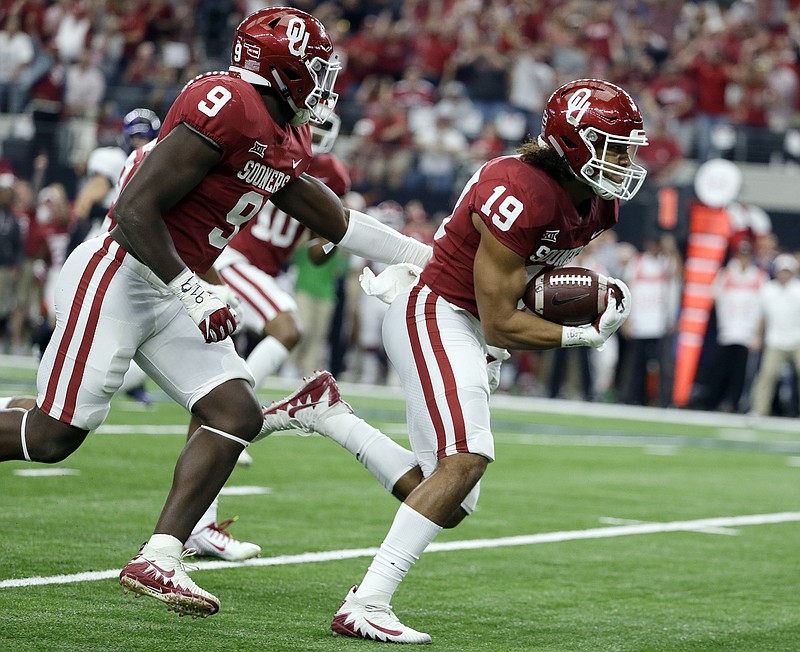 Oklahoma linebacker Caleb Kelly (19), shown scoring on a fumble return in the Big 12 title game earlier this month, believes the Sooners don't get noticed defensively unless they're struggling.