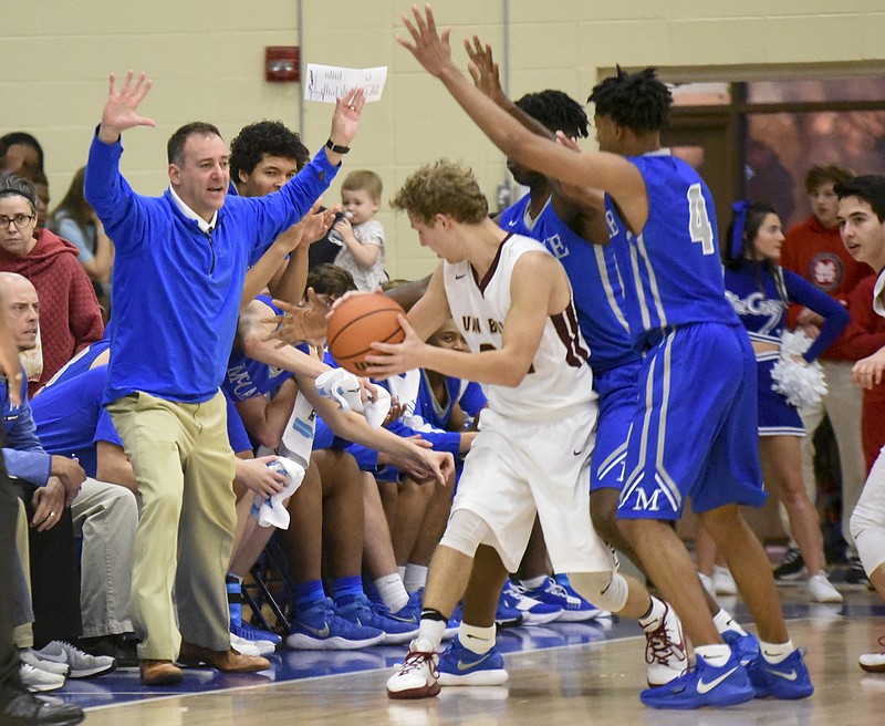 McCallie coach John Shulman gets in on the defense as his players surround Van Buren's Sawyer Shockley (33) in the 5:30 semi-final game Friday afternoon in the Best of Preps tournament at Chattanooga State.