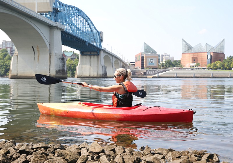 VML Creative Director Betsy Jemas begins her paddle Thursday, July 20, 2017, on the Tennessee River at the Market Street Bridge in Chattanooga, Tenn. A team of three from VML participated in various outdoor events in the Chattanooga area as part of a new Snapchat channel that the Tennessee Department of Tourist Development created to attract people to the many things to do in Tennessee.