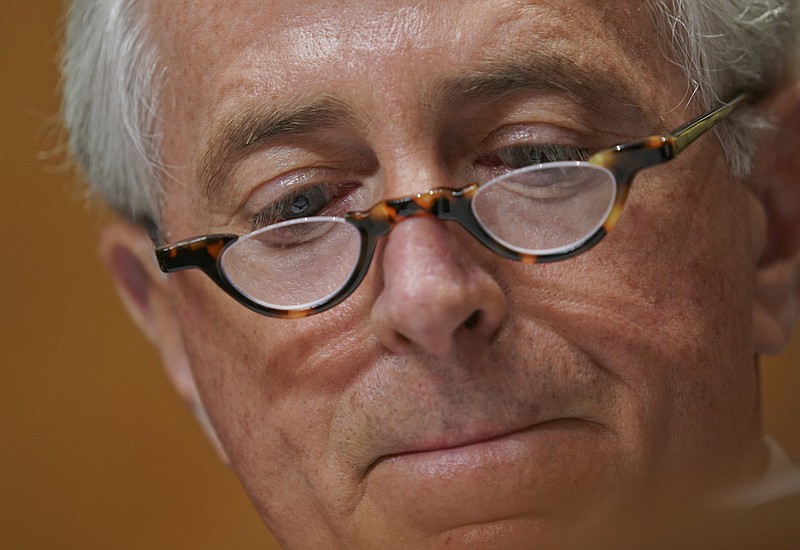 Chairman Sen. Bob Corker, R-Tenn., reads his notes during a Senate Foreign Relations Committee hearing on North Korea on Capitol Hill in Washington, Tuesday, Nov. 14, 2017. (AP Photo/Pablo Martinez Monsivais)