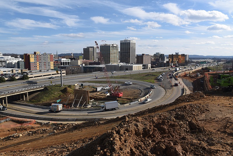In this view of downtown Chattanooga from Cameron Hill, crews with Dement Construction Company, of Jackson, Tenn., work to build a wall inside the Fourth Street ramps to U.S. Highway 27 in downtown Chattanooga. The Tennessee Department of Transportation is in charge of the update to the main thoroughfare that was formerly named Interstate 124.