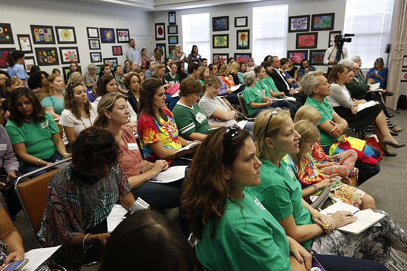 Citizens, many wearing green shirts to support CSLA, pack into a meeting of the Hamilton County Board of Education on Thursday, Sept. 21, 2017, in Chattanooga, Tenn.