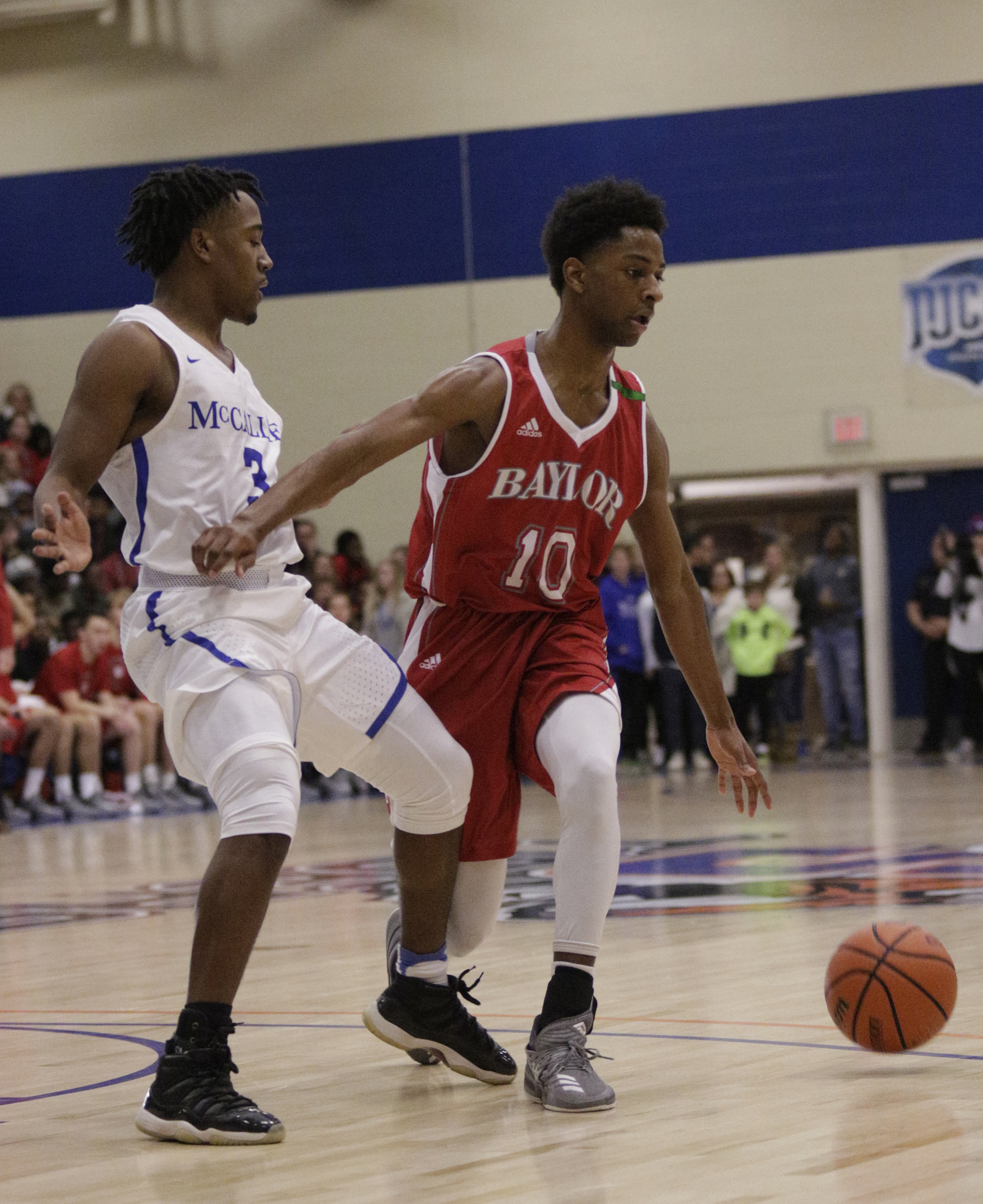 Baylor's Beyuan Hendricks dribbles around McCallie's Shannon Walker during their Times Free Press Best of Preps basketball tournament championship game at Chattanooga State Technical Community College on Saturday, Dec. 30, 2017, in Chattanooga, Tenn.
