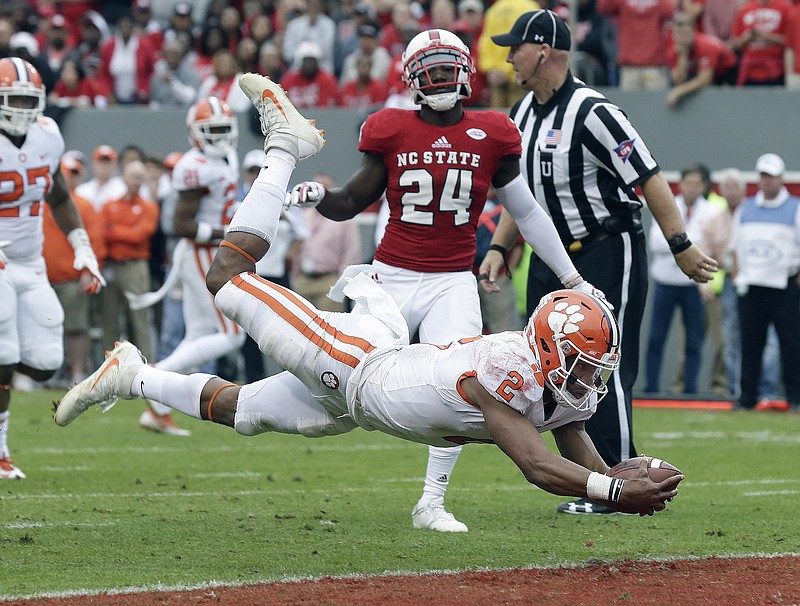 Clemson junior quarterback Kelly Bryant dives into the end zone against North Carolina State for one of his 11 rushing touchdowns this season. Bryant and the No. 1 Tigers face No. 4 Alabama on Monday night in the Sugar Bowl national semifinal.