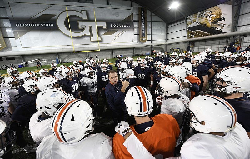 Auburn football coach Gus Malzahn talks to his team before last Thursday's practice at Georgia Tech, which housed the Tigers for multiple Peach Bowl workouts.