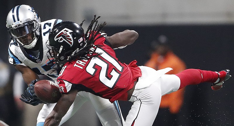 Atlanta Falcons cornerback Desmond Trufant (21) breaks up a pass intended for Carolina Panthers wide receiver Devin Funchess (17) during the first half of an NFL football game, Sunday, Dec. 31, 2017, in Atlanta. (AP Photo/John Bazemore)