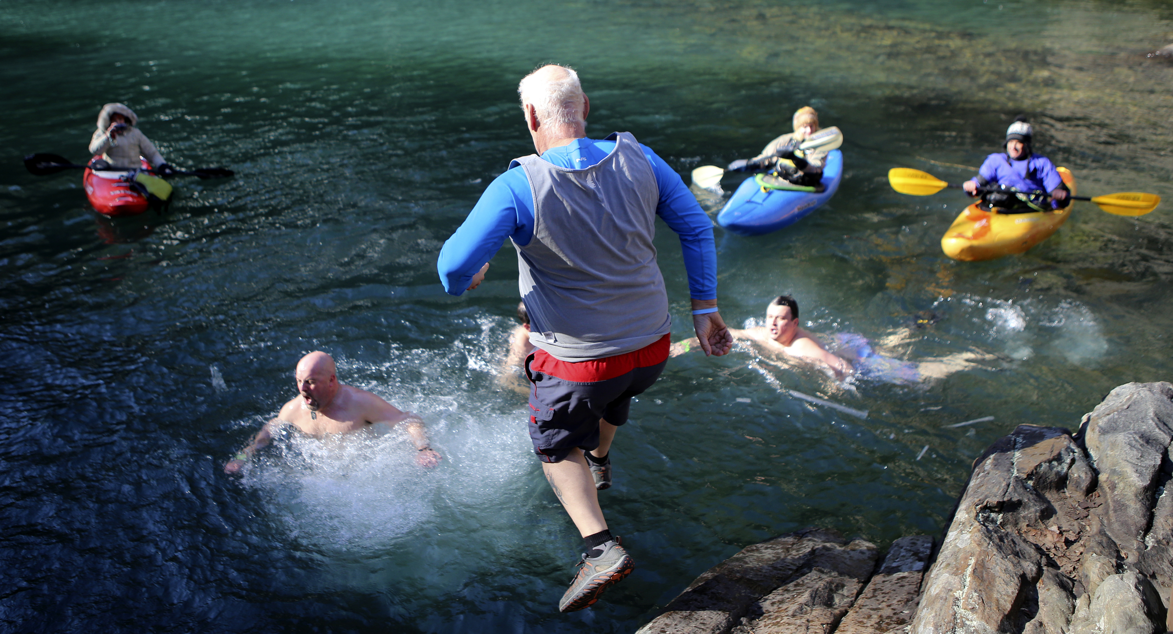 Cully Granger jumps into the water during the second annual Lula Lake Polar Plunge at Lula Lake on Monday, Jan. 1, 2018 in Lookout Mountain, Ga. The entrance fee for the Plunge helped fund the event and the on going conservation efforts by the Lula Lake Land Trust.