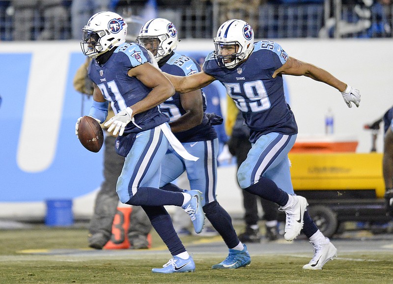 Tennessee Titans free safety Kevin Byard (31) celebrates with Wesley Woodyard (59) after Byard intercepted a pass against the Jacksonville Jaguars to stop their final drive in the last seconds of the fourth quarter in an NFL football game Sunday, Dec. 31, 2017, in Nashville, Tenn. The Titans won 15-10. (AP Photo/Mark Zaleski)