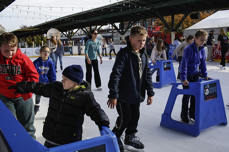 Children skate at Ice on the Landing, the temporary rink in the Chattanooga Choo Choo gardens. The skating rink is open until Jan. 21.