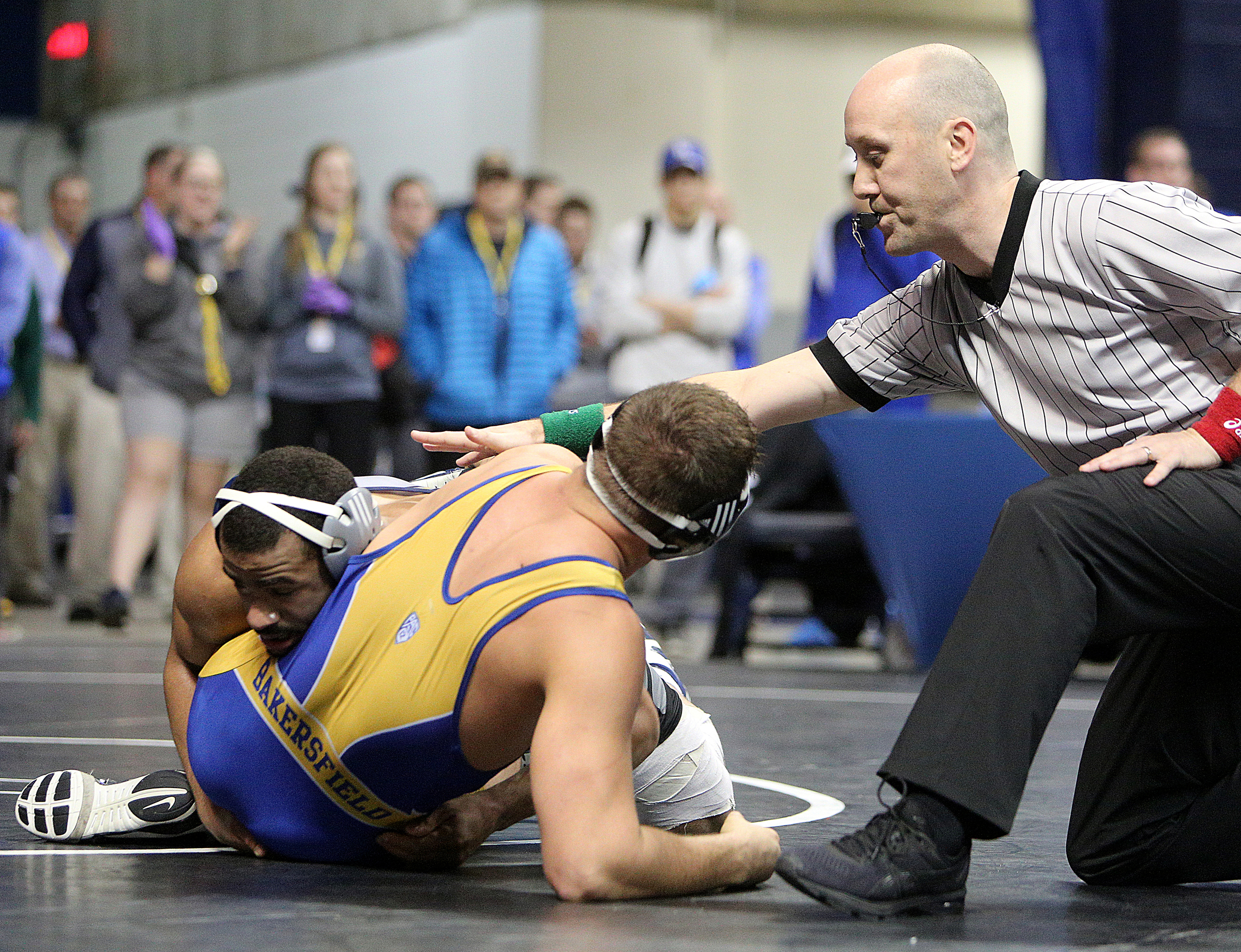 University of Tennessee at Chattanooga's Scottie Boykin attempts to pin California State University Bakersfield's Matt Williams as the referee calls the match during the Southern Scuffle College Wrestling Tournament Tuesday, Jan. 2, 2018 at McKenzie Arena at UTC in Chattanooga, Tenn. Williams placed sixth and Boykin placed fifth in the 197 pound bracket.