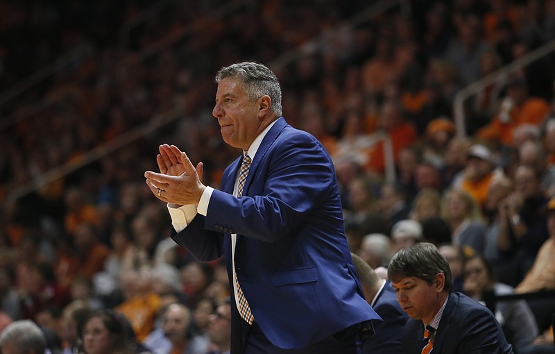 Auburn head coach Bruce Pearl claps for his team in the second half of an NCAA college basketball game Tuesday, Jan. 2, 2018, in Knoxville, Tenn. (AP Photo/Crystal LoGiudice)