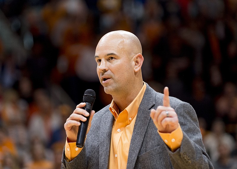 New Tennessee head football coach Jeremy Pruitt speaks to the audience before the first half of an NCAA college basketball game, Saturday, Dec. 9, 2017, in Knoxville, Tenn. (AP Photo/Calvin Mattheis)