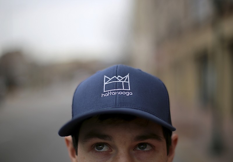 Hattanooga founder Ty Conner poses outside of the Camp House on Wednesday, Jan. 3, 2018 in Chattanooga, Tenn. Five dollars from each hat sold will be donated to Hamilton County Schools.