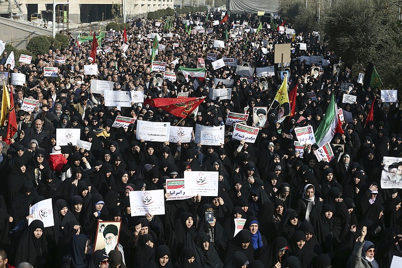 In this Dec. 30, 2017, photo, Iranian protesters chant slogans at a rally in Tehran, Iran. The Trump administration is calling on Iran's government to stop blocking Instagram and other popular social media sites as Iranians demonstrate in the streets. (AP Photo/Ebrahim Noroozi)