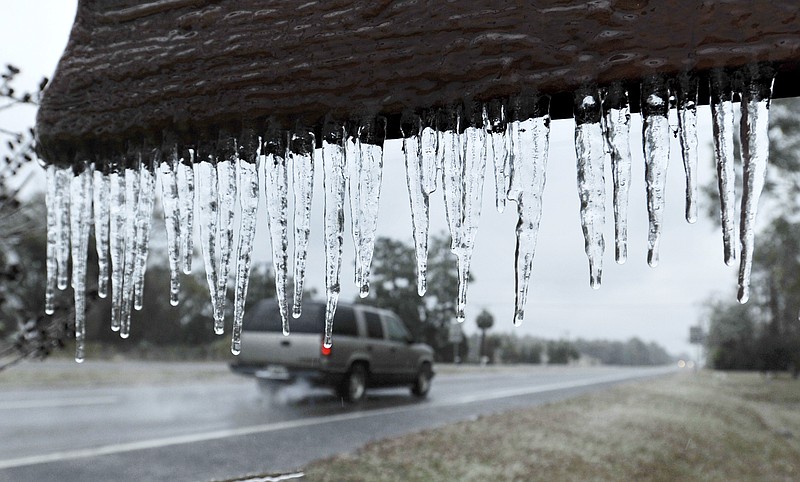 Icicles hang from the "Welcome to Hilliard sign" in Hilliard, Fla., Wednesday, Jan. 3, 2018.