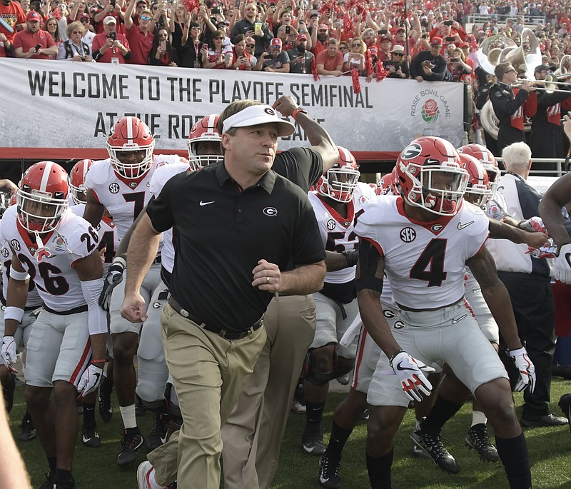 Georgia coach Kirby Smart leads his Bulldogs onto the field before Monday's Rose Bowl game against Oklahoma.