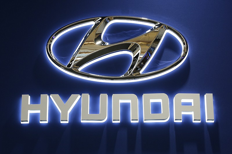 FILE - This Thursday, Feb. 11, 2016, file photo shows the Hyundai logo on display at the Pittsburgh International Auto Show in Pittsburgh. Hyundai and Volkswagen each say they're partnering with a U.S. autonomous vehicle tech firm led by former executives from Google, Tesla and Uber. On Thursday, Jan. 4, 2018, the companies announced partnerships with Aurora Innovation, started in 2017 by ex-Google autonomous car chief Chris Urmson and others. (AP Photo/Gene J. Puskar, File)