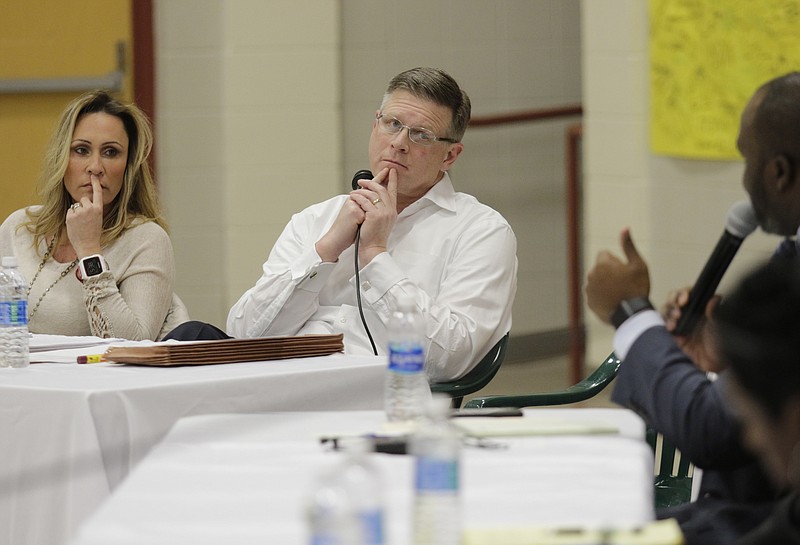 Signal Mountain Mayor Chris Howley, center, and boardmember Amy Speek, left, listen as schools superintendent Bryan Johnson speaks during a meeting between the Signal Mountain Town Council and the Hamilton County Board of Education at Nolan Elementary on Thursday, Jan. 4, 2018, in Signal Mountain, Tenn. Signal Mountain officials and members of the board discussed the town's consideration of splitting from the Hamilton County school system to form their own independent district.