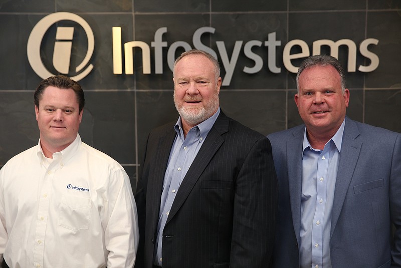 InfoSystems' Vice President of Operations Brent Hales, President and CEO Clay Hales and Vice President Scott Davis. (Staff photo by Erin O. Smith)
