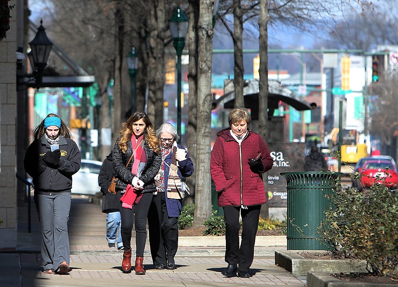 Michelle Henderson, Taylor Gallant, Joyce Evans and Judy Cartwright brave the cold to get lunch in downtown Chattanooga, Tenn., Friday, Jan. 5, 2018. The four are coworkers at the First Volunteer Bank. Temperatures are predicted to drop Sunday night with the possibility of freezing rain. 