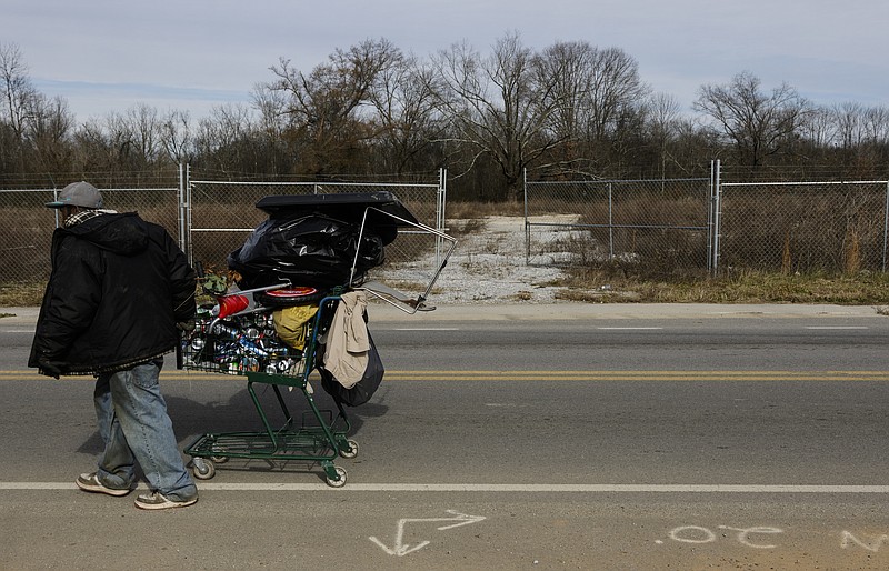 A man pulls a shopping car along Workman Road near a former EPA superfund site around the Piney Woods neighborhood on Wednesday, Dec. 27, 2017, in Chattanooga, Tenn. According to the Associated Press, these superfund sites are most commonly located near poor neighborhoods. The EPA has declared the Chattanooga area's superfund sites as safe.