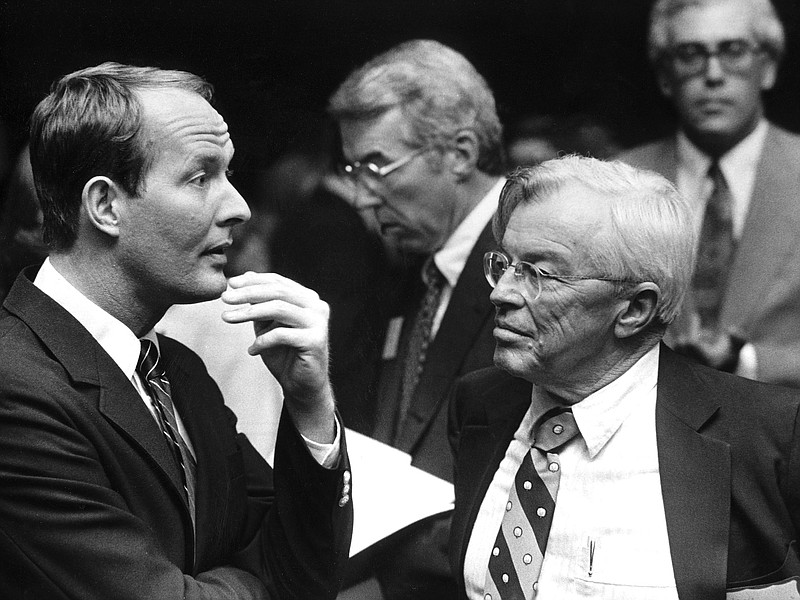 Tennessee Gov. Lamar Alexander, left, and Lewis R. Donelson III confer during the Memphis Jobs Conference on Nov. 3, 1981. Ron Terry is in background at left and Michael Rose is at back right. Donelson served as moderator of the four meetings. (Dave Darnell/The Commercial Appeal)