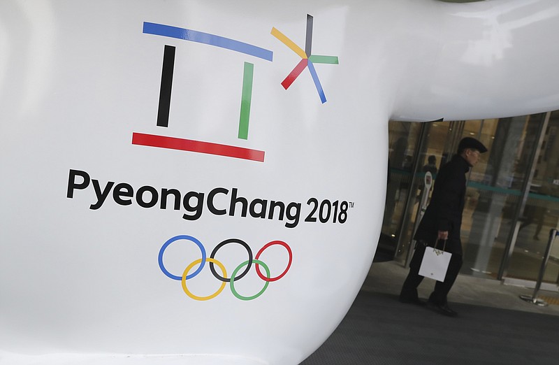 FILE - In this Thursday, Jan. 4, 2018, file photo, the official emblem of the 2018 Pyeongchang Olympic Winter Games is seen in downtown Seoul, South Korea. With little time to spare, North and South Korea are preparing to discuss Kim Jong Un's offer to send a delegation to next month's Winter Olympics. (AP Photo/Lee Jin-man)