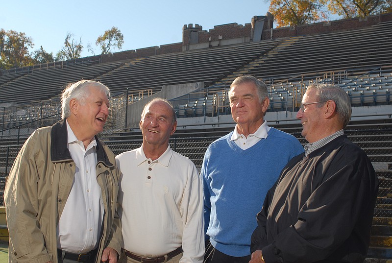 Jerry Arnold, Don Hill, John Green, and Harold Wilkes, members of the University of Chattanooga football team that defeated the University of Tennessee in Knoxville 50 years ago, are seen at Chamberlain Field on the UTC campus. 