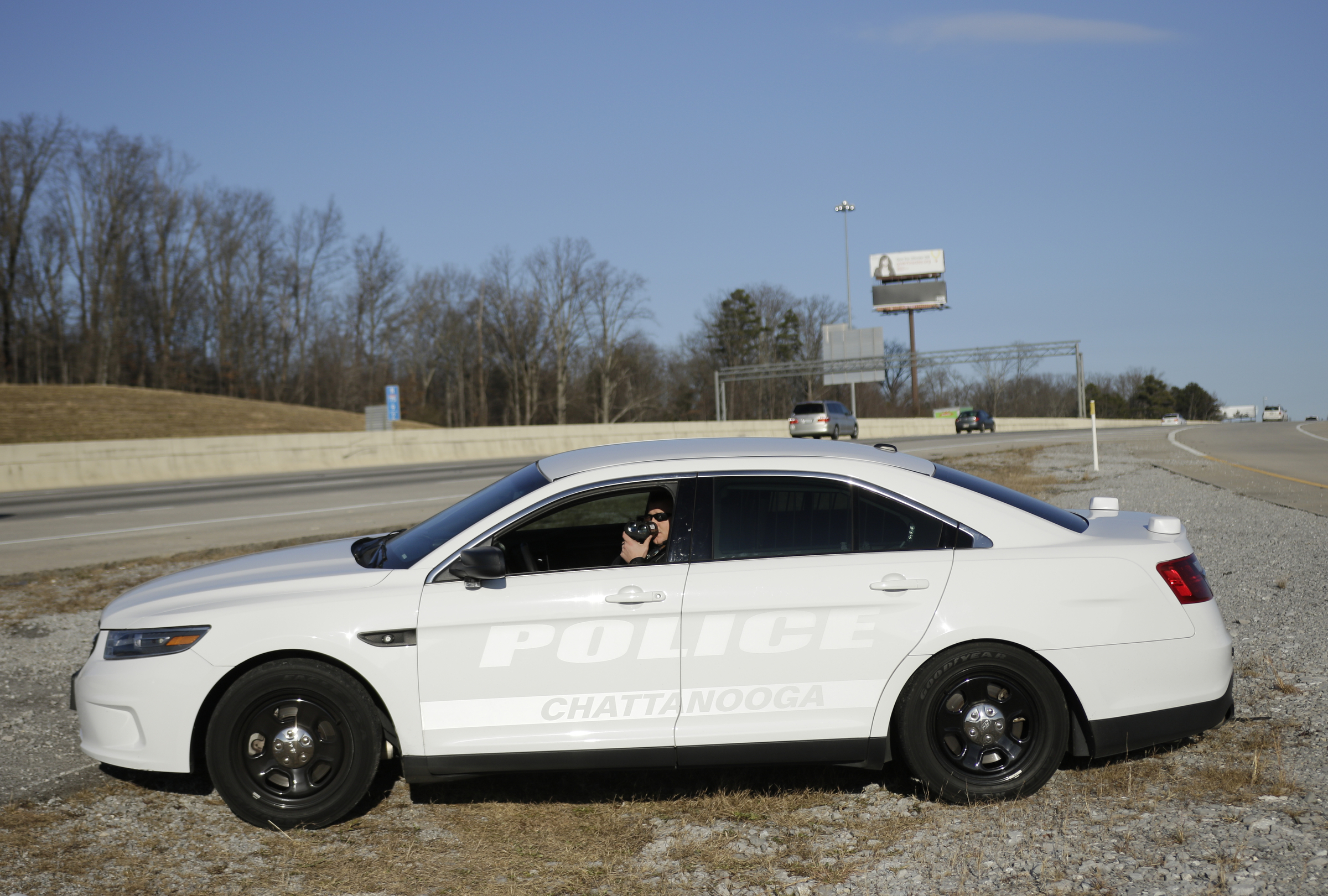 Officer Chris Mullinix uses a laser-assisted radar gun to look for speeding vehicles on Interstate 75 while on traffic patrol on Friday, Jan. 5, 2018, in Chattanooga, Tenn.