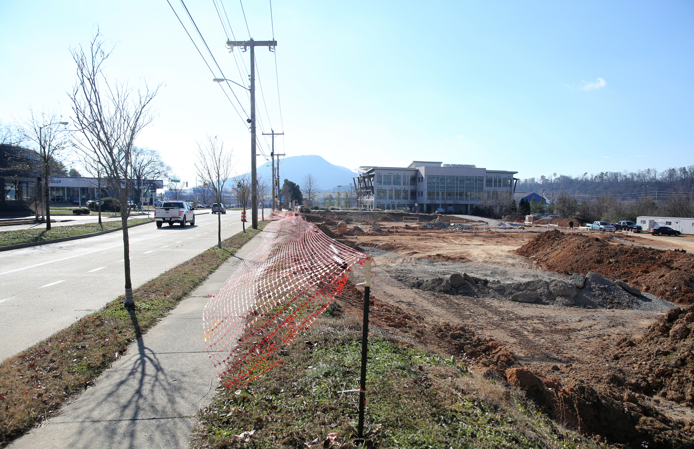 Construction is underway at the corner of Riverfront Parkway and West Ninth Avenue Thursday, Jan. 4, 2018 in Chattanooga, Tenn. There will be a public hearing Monday on the plan to use tax money to expand M.L. King Boulevard straight across Riverfront parkway to the Blue Goose Hallow trailhead.
