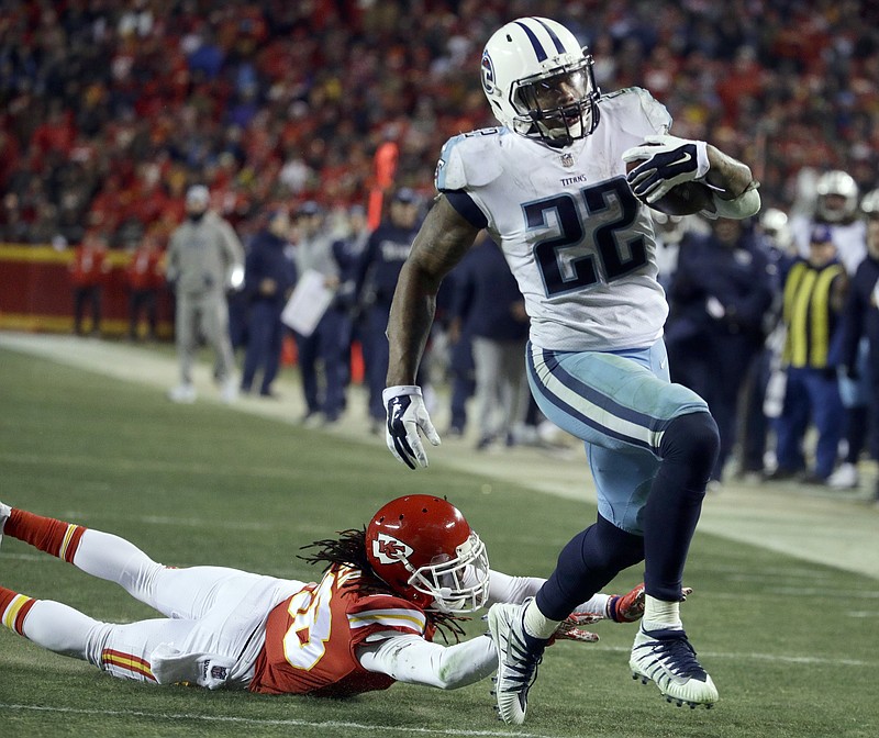 Tennessee Titans running back Derrick Henry (22) runs past Kansas City Chiefs defensive back Ron Parker (38) for a 35-yard touchdown during the second half of an NFL wild-card playoff football game in Kansas City, Mo., Saturday, Jan. 6, 2018. (AP Photo/Charlie Riedel)