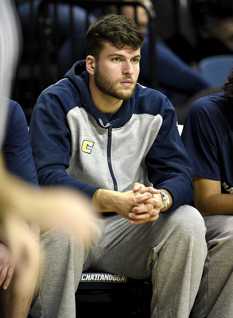Ramon Vila, a recent transfer to UTC, watches the action from the bench.  The East Tennessee State University Buccaneers visited the University of Tennessee Chattanooga Mocs in Southern Conference men's basketball action at McKenzie Arena on January 6, 2018.  
