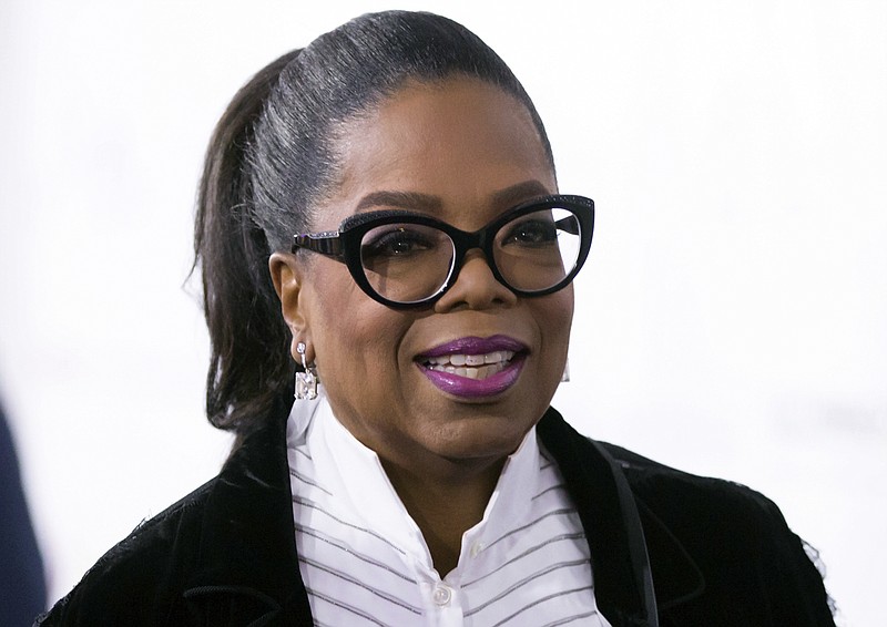 In this Oct. 21, 2017, file photo, Oprah Winfrey arrives for the David Foster Foundation 30th Anniversary Miracle Gala and Concert, in Vancouver, British Columbia. Winfrey will be the recipient of the Cecil B. DeMille Award at January's Golden Globes. (Darryl Dyck/The Canadian Press via AP, File)