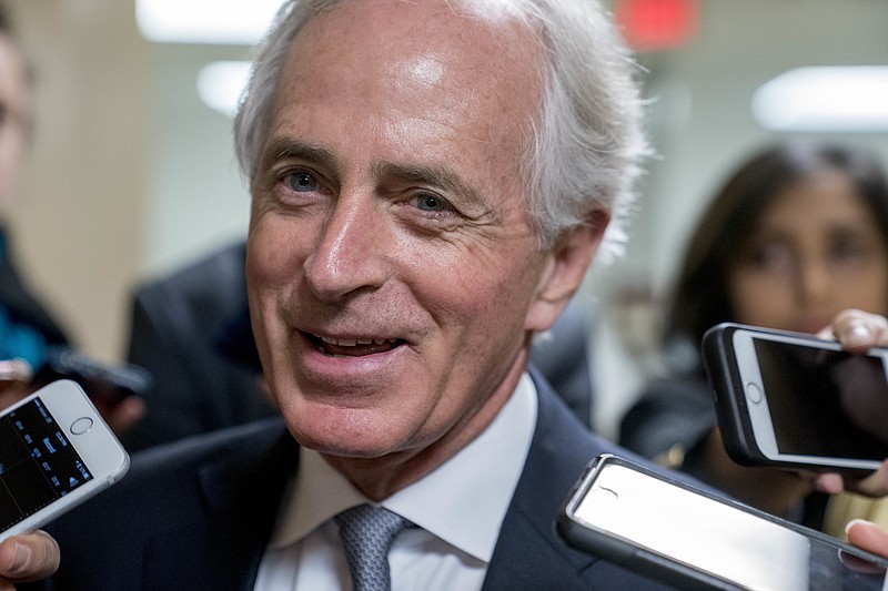 Sen. Bob Corker, R-Tenn., speaks to reporters as Congress prepares to vote on the biggest reshaping of the U.S. tax code in three decades, on Capitol Hill, Tuesday, Dec. 19, 2017, in Washington. (AP Photo/Andrew Harnik)
