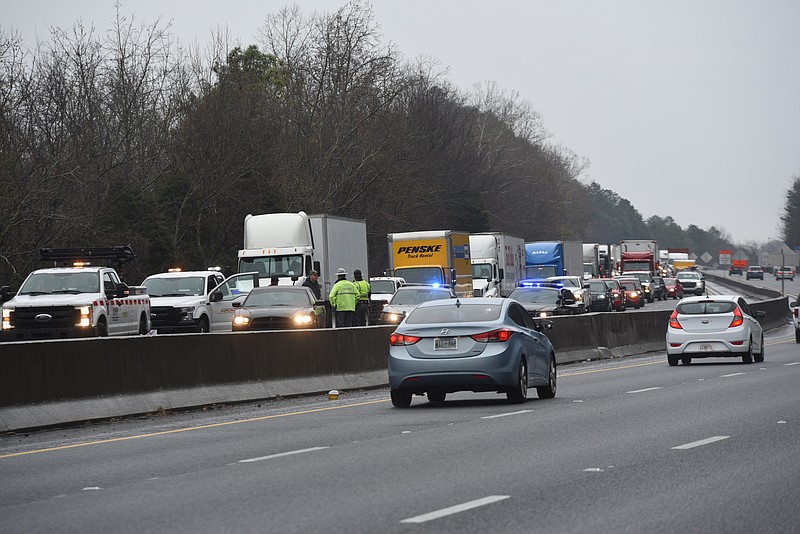 Monday morning's icy conditions backs traffic up for miles on Interstate 75 to the south of Alabama Highway following a predawn pileup of 35 vehicles between exit 345 and 348. The cluster of wrecked vehicles were located just below the stair-stepped escarpment of Taylor's Ridge in Ringgold, Ga.