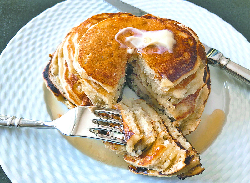 This undated photo shows ripe banana pancakes. The bananas are mashed as if making banana bread and added to the batter right before the pancakes are prepared. The result is almost like banana bread pancakes. (AP Photo/Elizabeth Karmel)