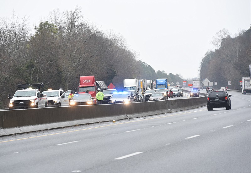 Monday morning's icy conditions backs traffic up for miles on Interstate 75 to the south of Alabama Highway following a pre-dawn pileup of 35-vehicles between exit 345 and 348. The cluster of wrecked vehicles were located just below the stair-stepped escarpment of Taylor's Ridge in Ringgold. 